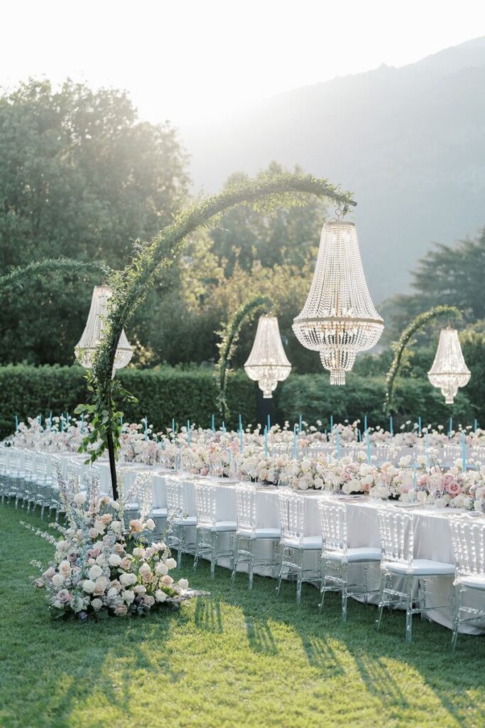 Garden wedding ceremony setup with chandeliers at Villa Balbiano on Lake Como, Italy.
